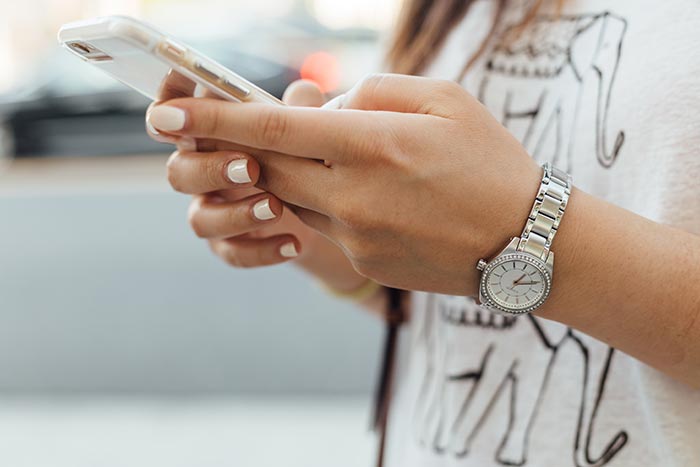 woman holding phone