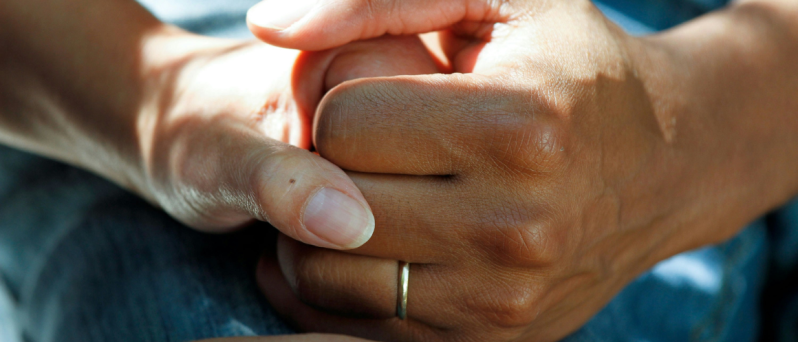 Doctor patient holding hands